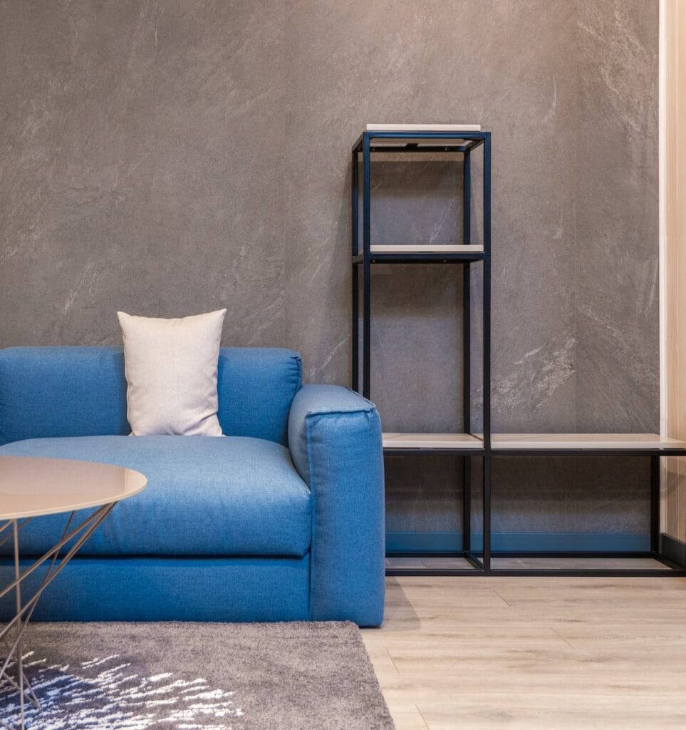 cozy sofa and empty bookshelf in Property Management Tips and Tricks