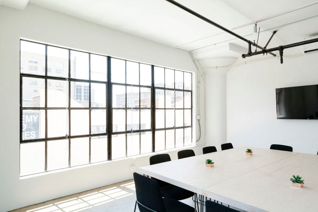 An empty conference room with a square Lutz real estate management